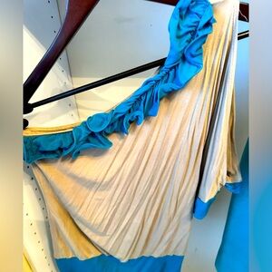 One shoulder shirt. Tan with turquoise.